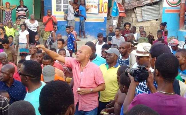 HAITI: Apparition surprise de Martelly et de son fils Olivier dans les rues de Port-au-Prince